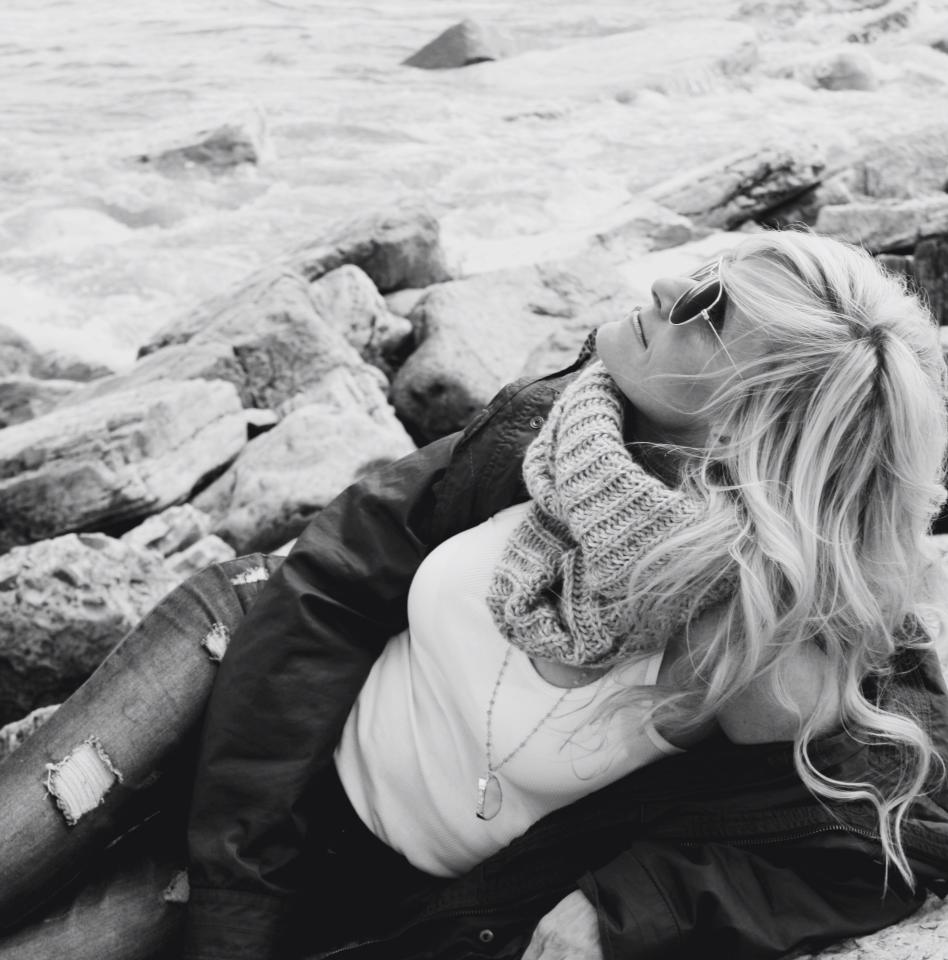 Michele of Hello Lovely on a rocky lakeshore. #coastalgrandmother