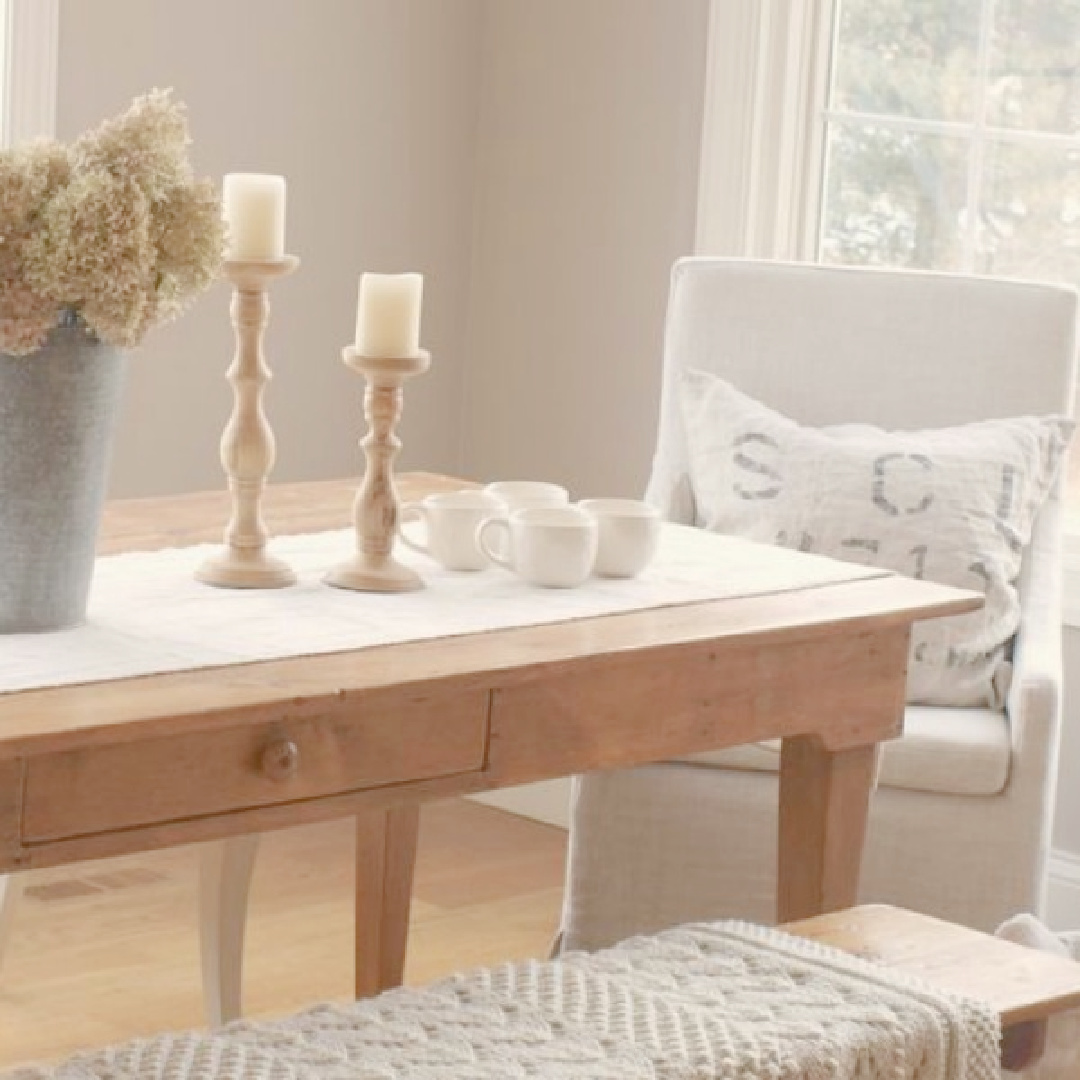 Benjamin Moore Ashley Gray walls in Hello Lovely's country French kitchen with farm table and pale linen.
