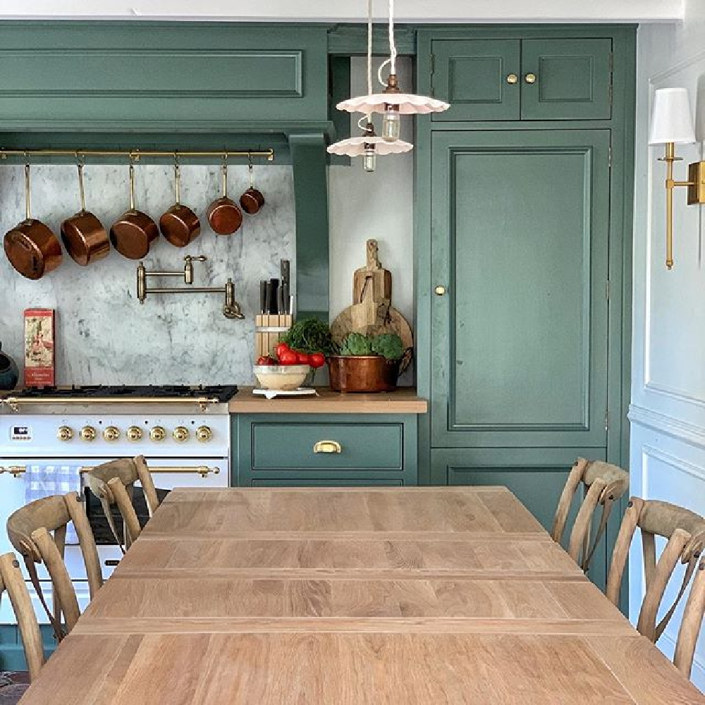 Smoke Green paint (F&B) on French farmhouse kitchen cabinets. Design by Vivi et Margot has a luxurious Ilve range #frenchfarmhouse #smokegreen #paintcolors #frenchkitchen #kitchendesign #farrowandballsmokegreen #greencabinets #ilverange #vivietmargot