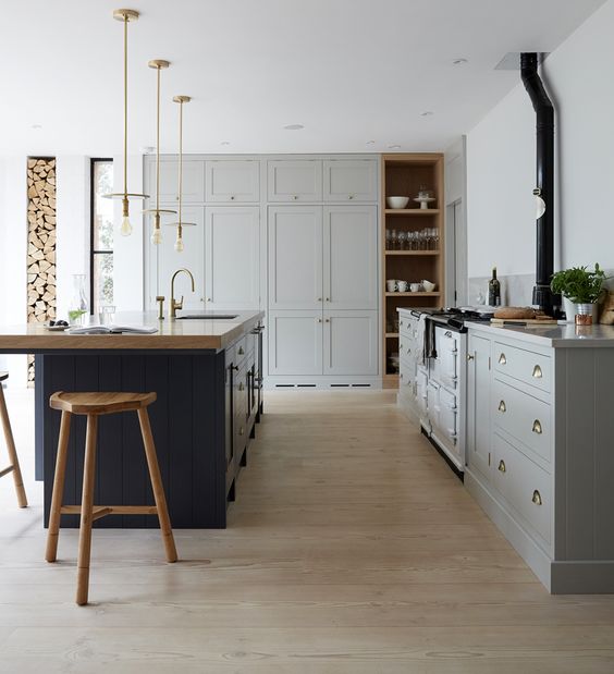 Farmhouse kitchen with cabinets painted in Pavilion Gray estate eggshell by Farrow & Ball. These are Workstead pendants from Trouva. #paviliongray #farrowandballpaviliongray #farmhousekitchen #greycabinets #graykitchen