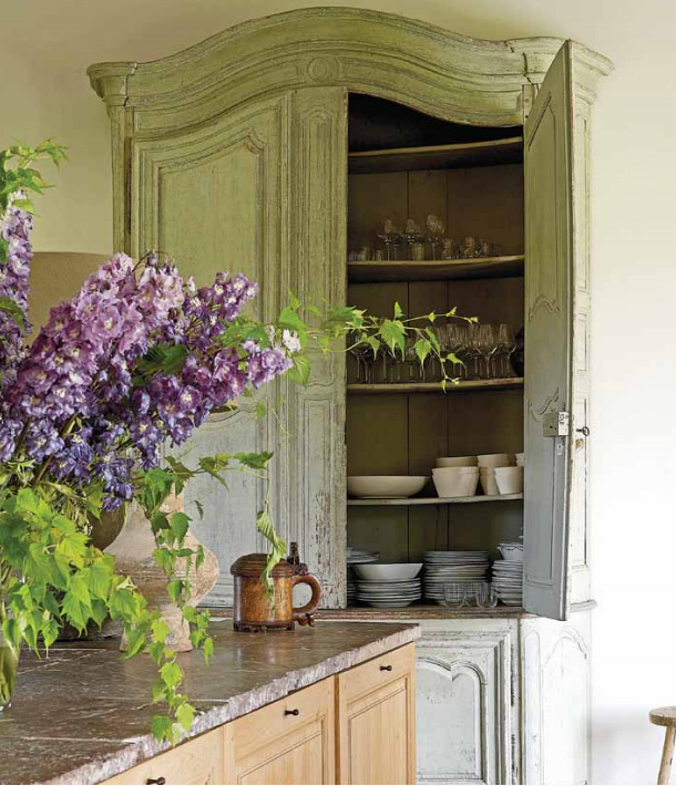 Old rustic cupboard in Belgian kitchen of Brigitte Garnier, an antiques dealer and owner of The Little Monastery near Bruges.