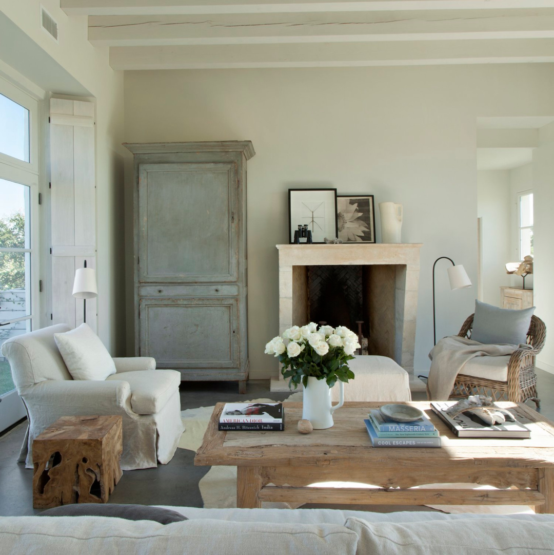 Living room with antques in Eleanor Cummings designed modern French farmhouse near Round Top, TX in MILIEU magazine. #modernfrench #europeancountry