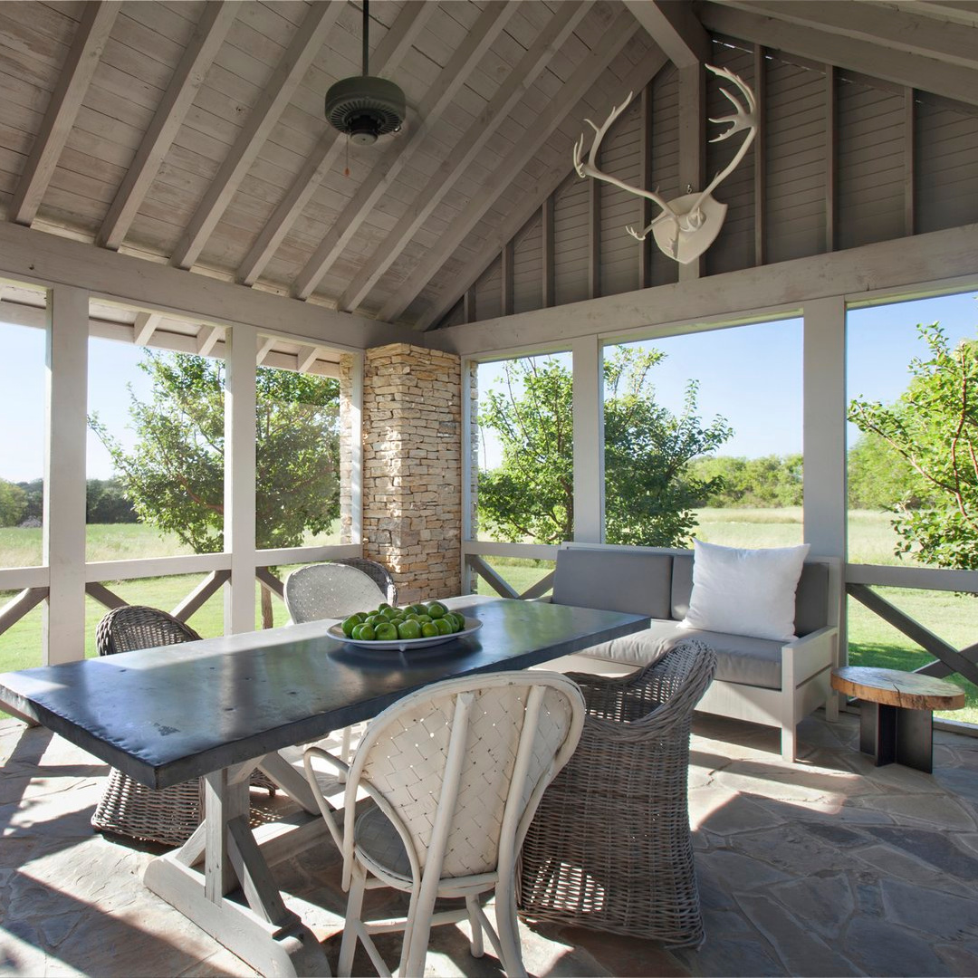 Screen porch in Eleanor Cummings designed modern French farmhouse near Round Top, TX in MILIEU magazine. #modernfrench #europeancountry