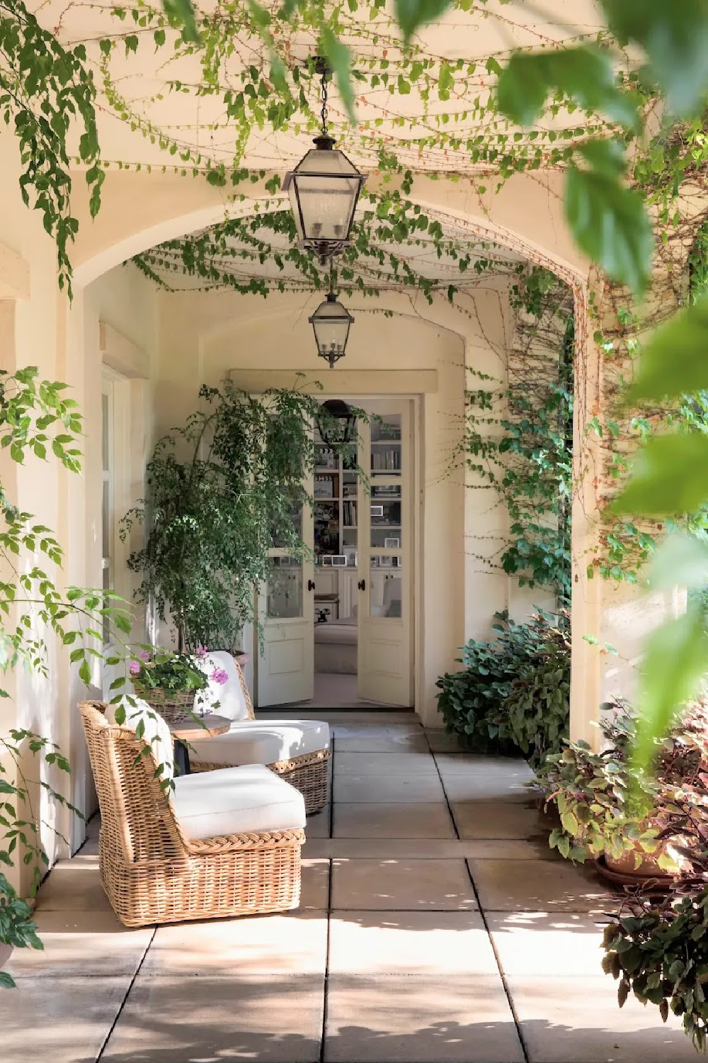 Loggia with arches in Nancy Meyers Provencal home in Los Angeles after renovation. #nancymeyers